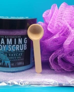 Flaming body scrub with a spoon on a blue background.