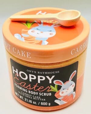 A tin of happy easter body scrub with a spoon.