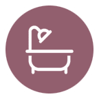 An icon of a bathtub in a purple circle.